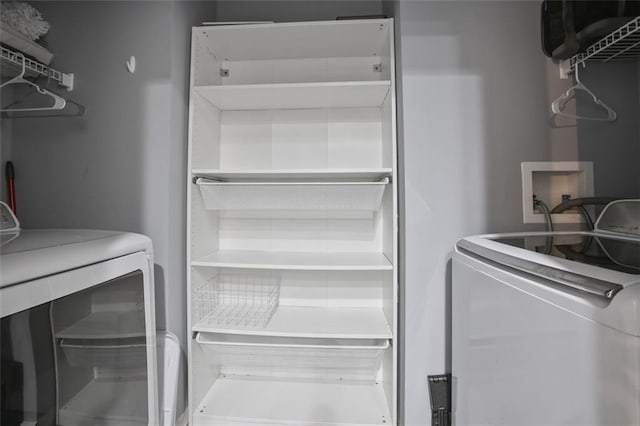 laundry room featuring separate washer and dryer