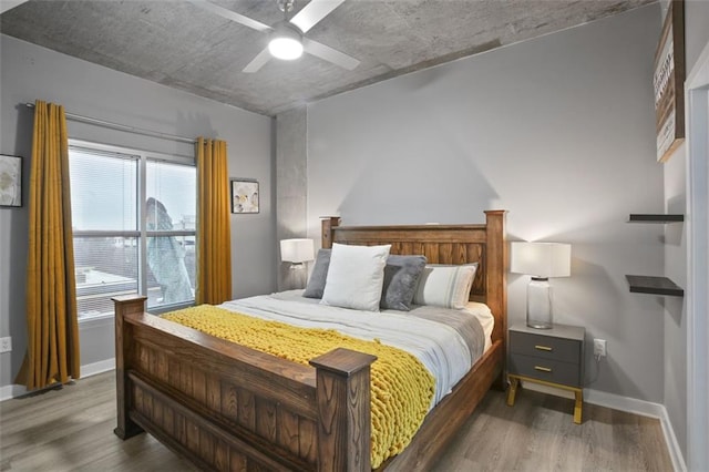 bedroom with hardwood / wood-style flooring and ceiling fan