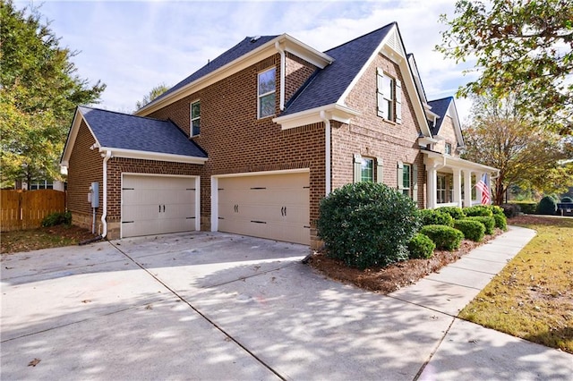 view of side of property with a garage