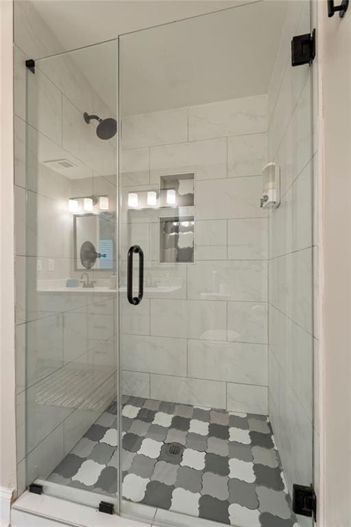 bathroom featuring a shower stall