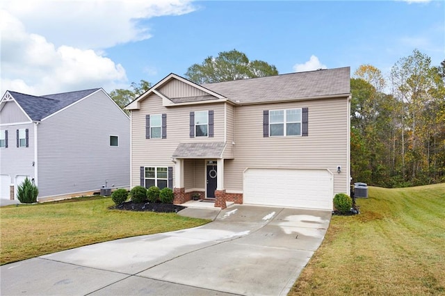 view of front of house featuring cooling unit, a garage, and a front lawn