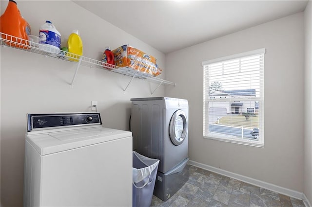 laundry room with separate washer and dryer