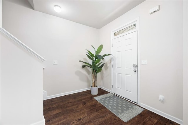 foyer entrance with dark wood-type flooring