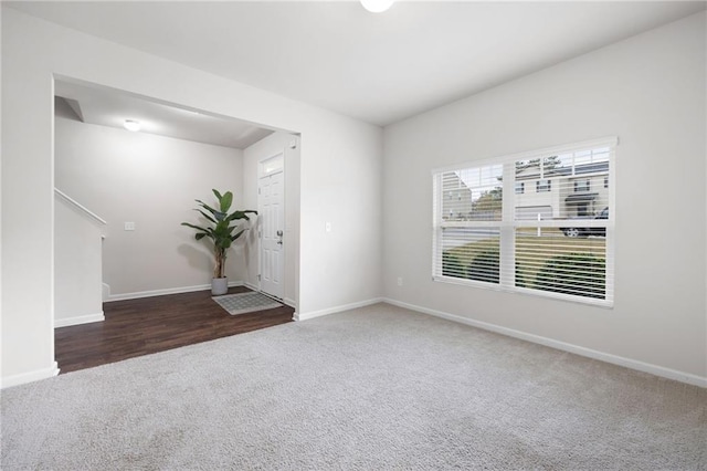 unfurnished room featuring dark wood-type flooring