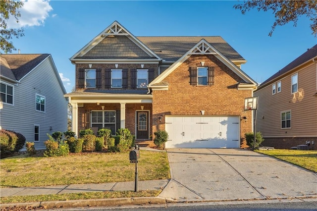 craftsman-style house featuring a front yard and a garage