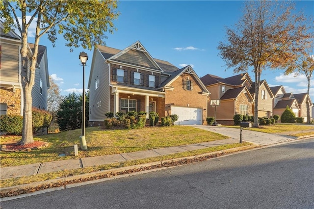 view of front of property featuring a garage and a front lawn