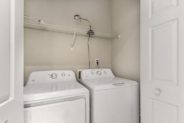 laundry area with washing machine and dryer