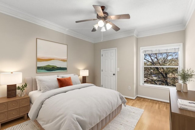 bedroom with light hardwood / wood-style flooring, ornamental molding, and ceiling fan