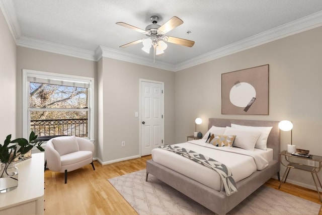 bedroom featuring crown molding, ceiling fan, and wood-type flooring