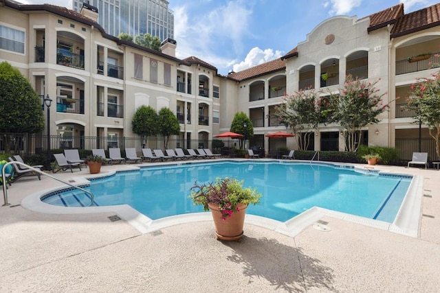 view of swimming pool featuring a patio area