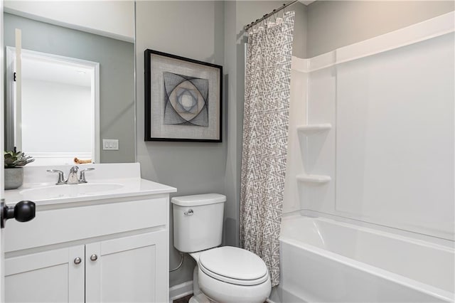 bathroom with vanity, toilet, and shower / bath combo