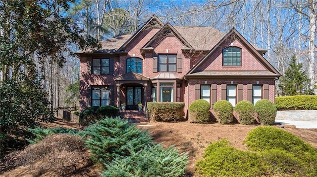 craftsman inspired home featuring brick siding