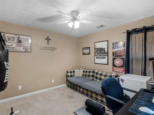 office area featuring light colored carpet and ceiling fan