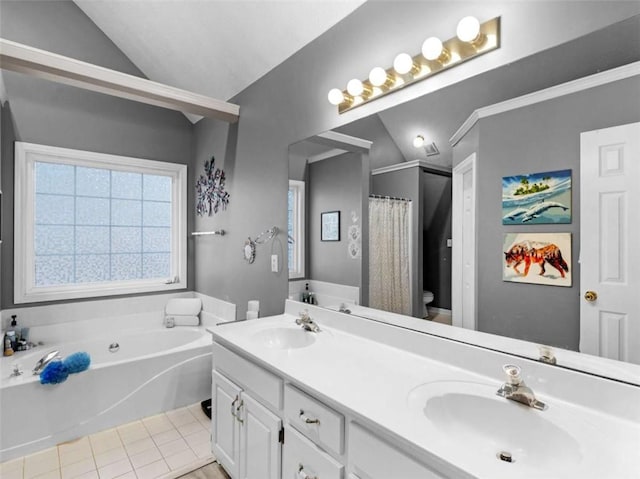 bathroom featuring tile patterned flooring, vanity, a tub to relax in, vaulted ceiling, and toilet