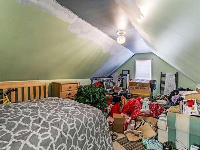 carpeted bedroom featuring lofted ceiling