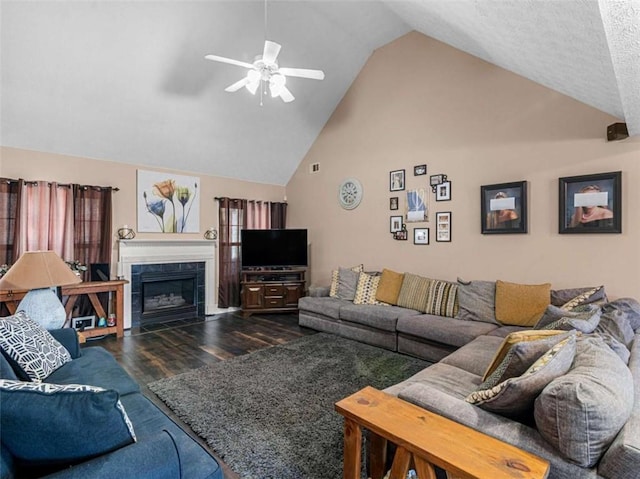 living room featuring a fireplace, high vaulted ceiling, dark hardwood / wood-style floors, and ceiling fan