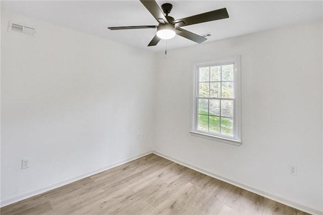 empty room with light hardwood / wood-style flooring and ceiling fan