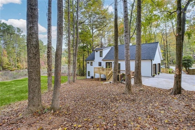 view of front of house with a garage and a wooden deck