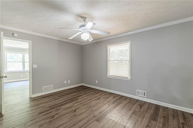 empty room featuring ceiling fan, a textured ceiling, ornamental molding, and dark hardwood / wood-style flooring