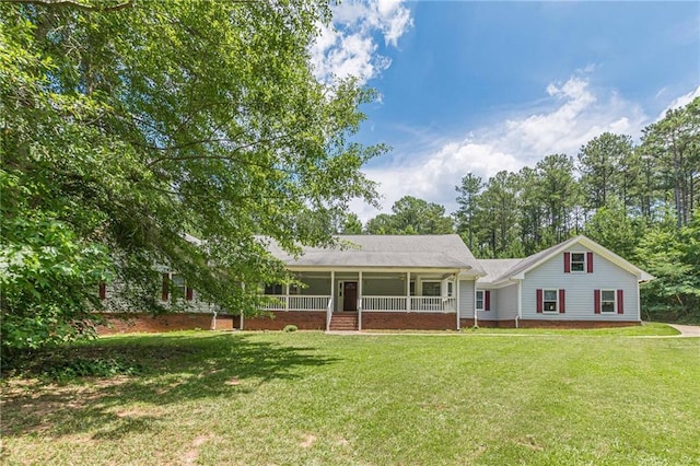 ranch-style home featuring a front yard and a porch