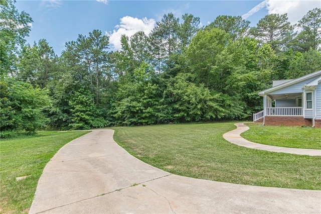 view of yard with covered porch