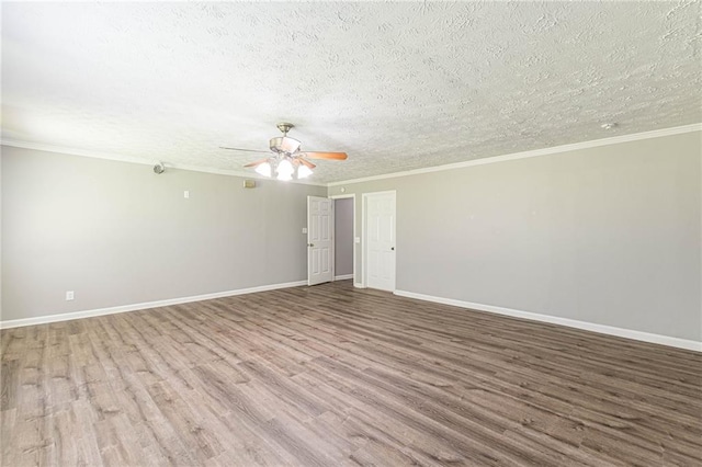 empty room featuring ornamental molding, hardwood / wood-style floors, a textured ceiling, and ceiling fan