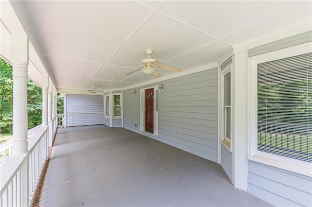 view of patio with ceiling fan and a porch