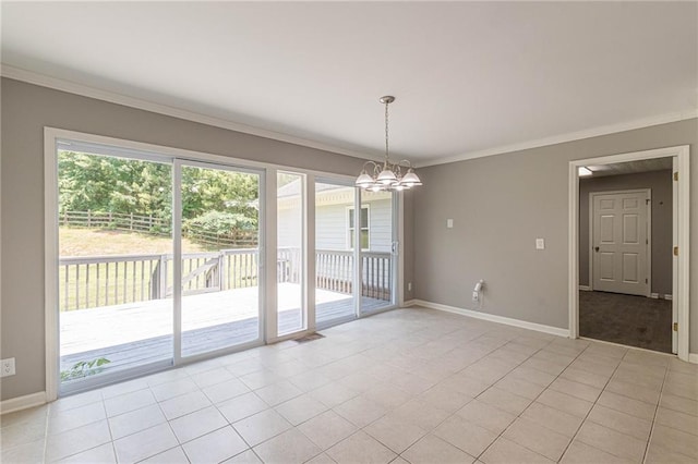 unfurnished dining area with crown molding, a notable chandelier, and light tile patterned floors