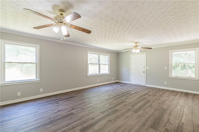 unfurnished room with ornamental molding, a textured ceiling, dark wood-type flooring, and ceiling fan