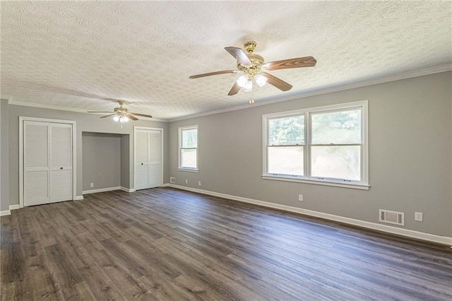 unfurnished room featuring ceiling fan, a textured ceiling, ornamental molding, and dark hardwood / wood-style flooring