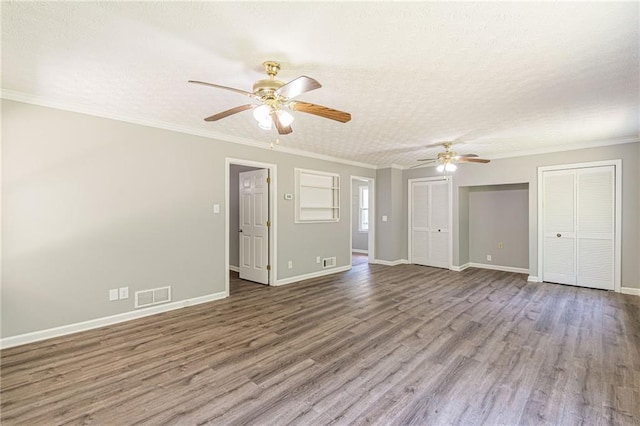 spare room featuring ceiling fan, crown molding, a textured ceiling, and hardwood / wood-style floors