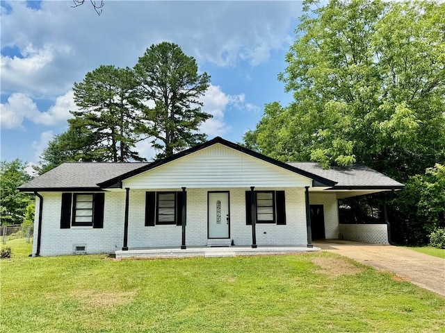 312 E Broad St, Winder, GA 30680 - view of front of property featuring driveway, brick siding, an attached carport, a front lawn, and a porch