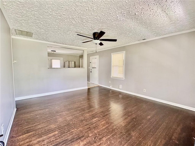 312 E Broad St, Winder, GA 30680 - empty room with wood finished floors, ceiling fan, ornamental molding, baseboards, and a textured ceiling