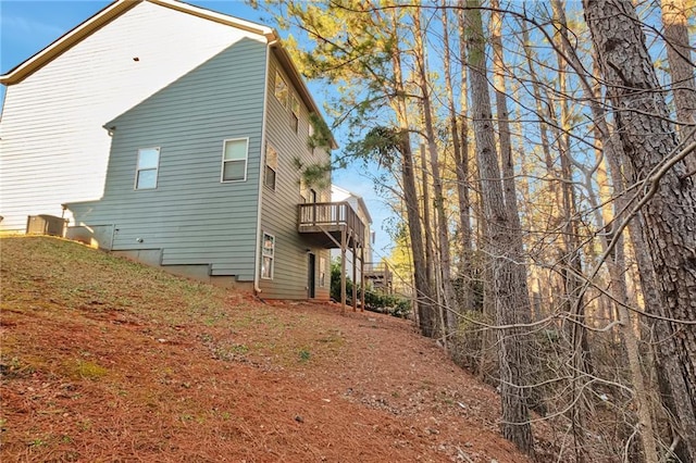 view of home's exterior with a balcony