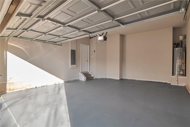 garage featuring a garage door opener, electric panel, and water heater