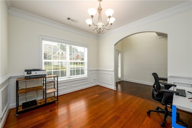 1076 Scenic Park Trl, Lawrenceville, GA 30046 - home office with arched walkways, a chandelier, wood finished floors, crown molding, and a wainscoted wall
