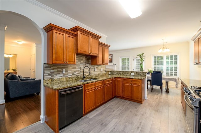 1076 Scenic Park Trl, Lawrenceville, GA 30046 - kitchen featuring dishwashing machine, a sink, gas range, a chandelier, and light stone countertops