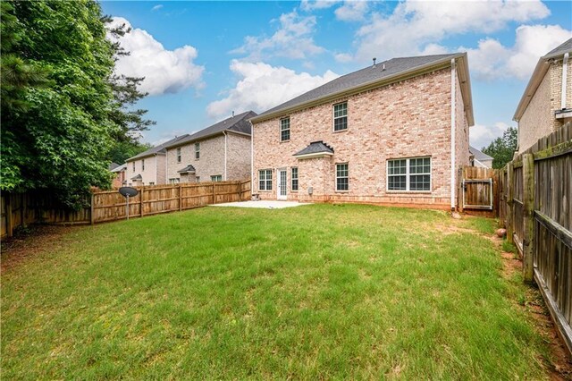 1076 Scenic Park Trl, Lawrenceville, GA 30046 - rear view of house with brick siding and a patio area