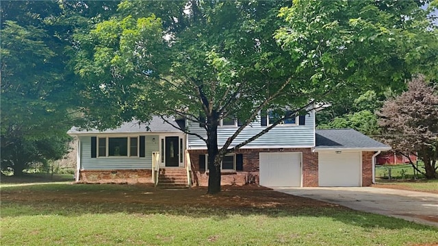 1102 Tony Valley Dr, Conyers, GA 30013 - tri-level home featuring concrete driveway, a front yard, entry steps, and brick siding