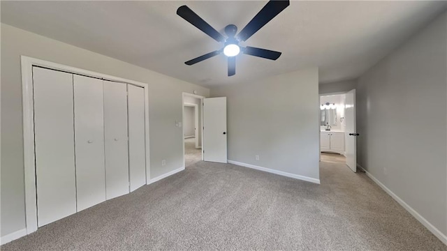 1102 Tony Valley Dr, Conyers, GA 30013 - unfurnished bedroom with carpet floors, a closet, a ceiling fan, and connected bathroom