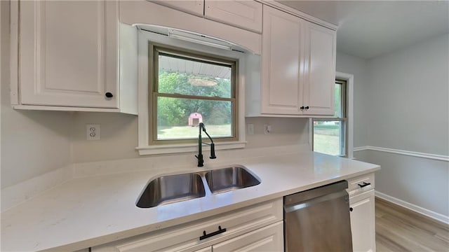 1102 Tony Valley Dr, Conyers, GA 30013 - kitchen featuring stainless steel dishwasher, white cabinets, and light wood-style flooring