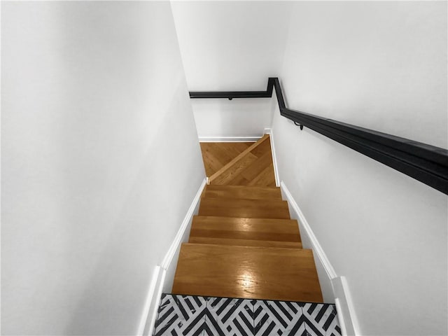 stairway featuring hardwood / wood-style flooring