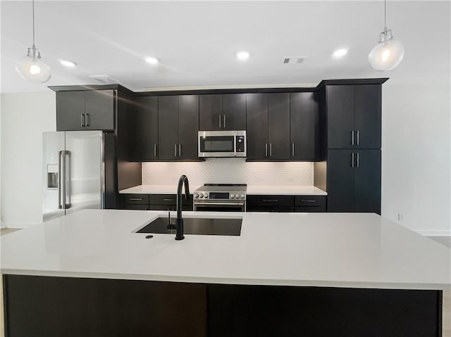371 Pratt Dr SE Unit 203, Atlanta, GA 30315 - kitchen featuring a sink, stainless steel appliances, visible vents, backsplash, and light countertops