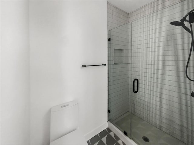 bathroom with walk in shower and tile patterned floors