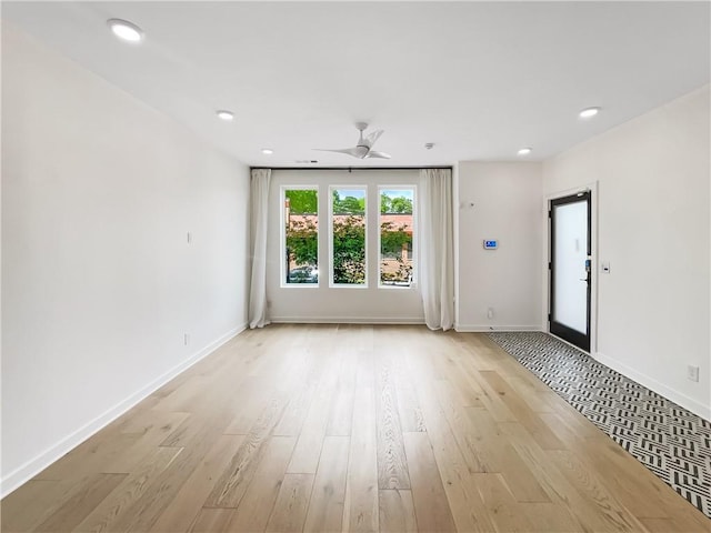 371 Pratt Dr SE Unit 203, Atlanta, GA 30315 - unfurnished living room with baseboards, light wood-type flooring, and recessed lighting