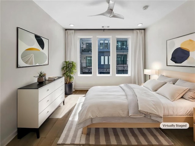 371 Pratt Dr SE Unit 203, Atlanta, GA 30315 - bedroom featuring baseboards, ceiling fan, and wood finished floors