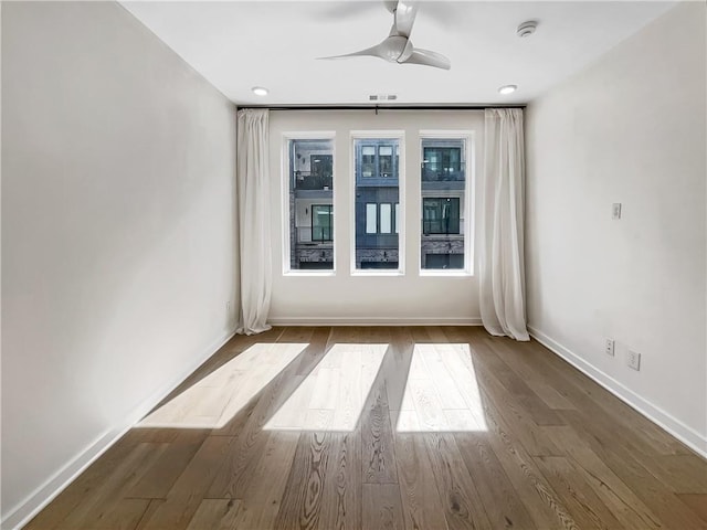 371 Pratt Dr SE Unit 203, Atlanta, GA 30315 - spare room featuring visible vents, wood finished floors, baseboards, and ceiling fan