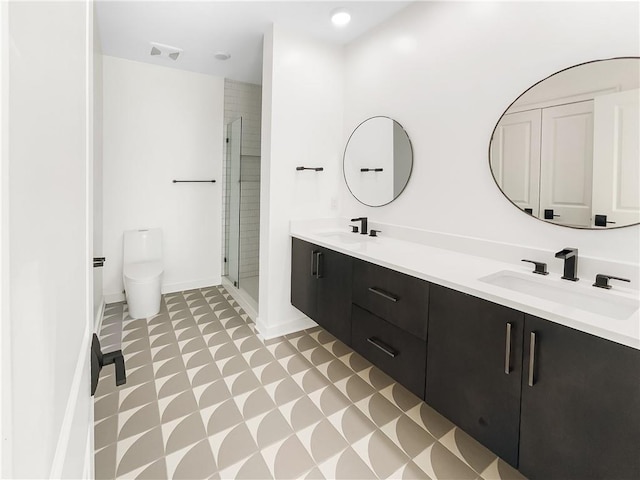 371 Pratt Dr SE Unit 203, Atlanta, GA 30315 - full bathroom featuring a sink, toilet, a shower stall, and tile patterned floors