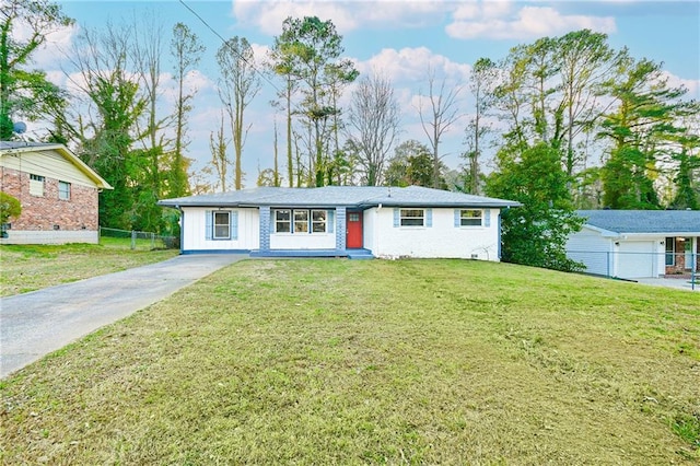 ranch-style house with a front yard and fence