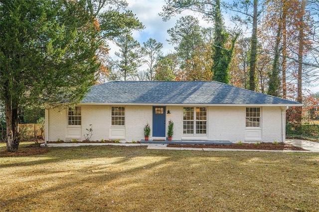 ranch-style house featuring a front lawn